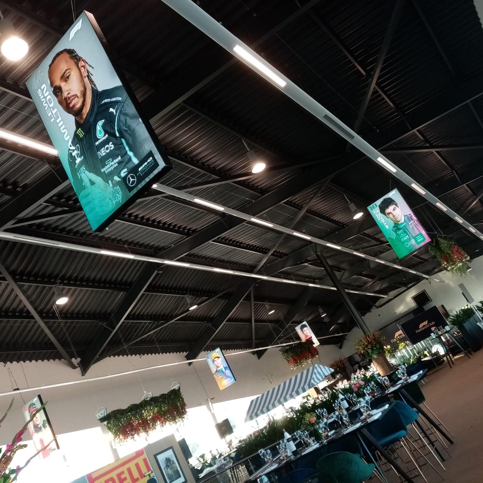F1 hospitality lounge with driver banners